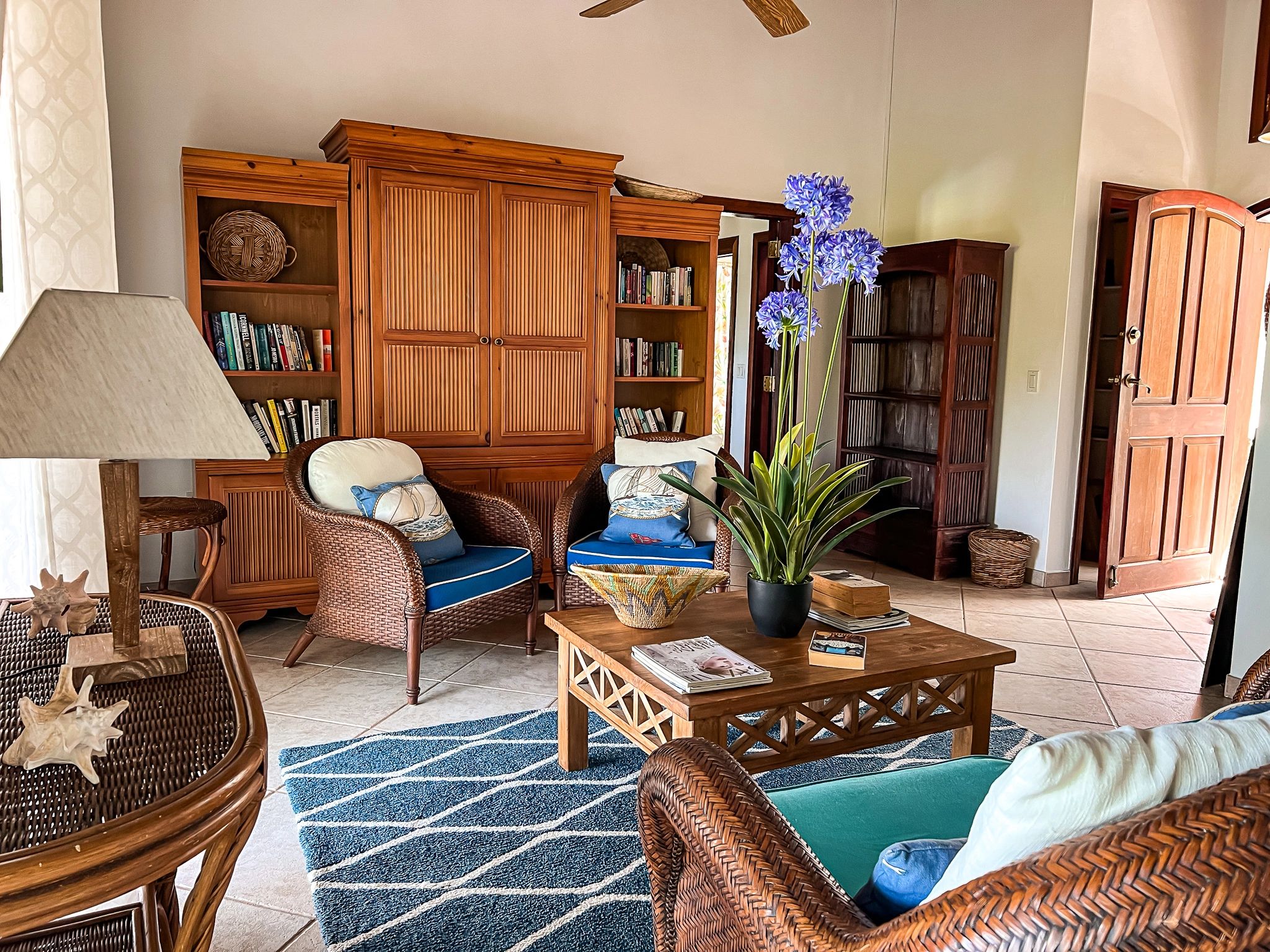 Sitting room with sofas and chairs and plenty of books to choose from.