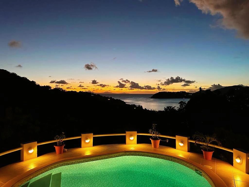 Amazing sunset over Montserrat from The Garden House's private swimming pool