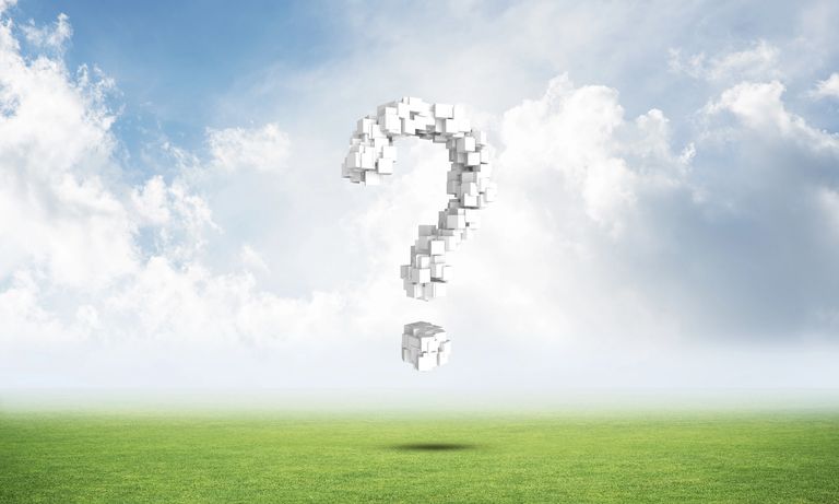 meadow and cloudy sky with question mark in the guise of a hot air balloon