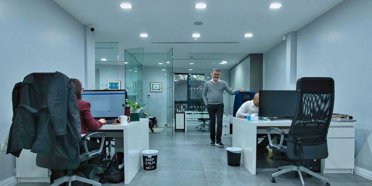 Richmond corporate headshots team boss in modern office environment