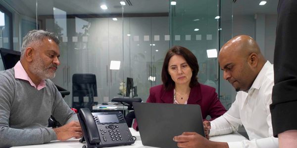 Corporate team members collaborating in a Richmond office - lifestyle photography by flash spacey