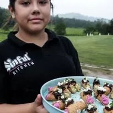 Server holding tray of appetizers