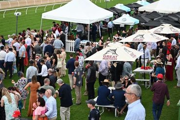Outdoor event with white tents