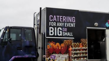Side view of black catering van