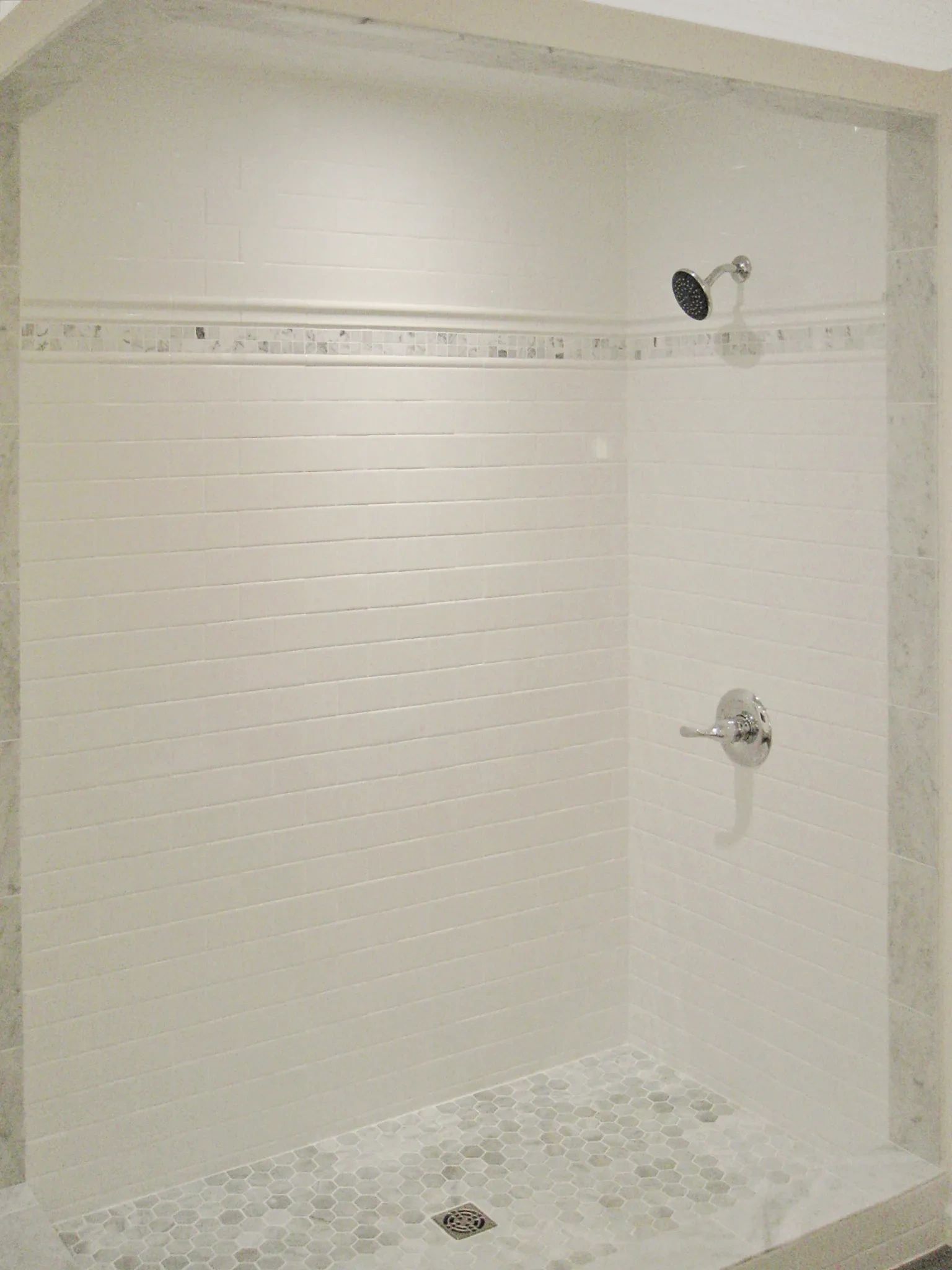 Marble and tile shower enclosure