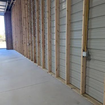 Large private storage unit at ToyBox Storage Suites with tall overhead door