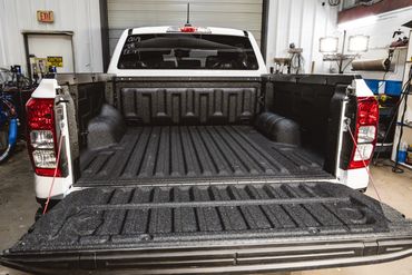 A premium example of a well-executed bedliner job from Madison Auto Trim and Madison Fleet Works