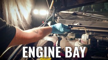 Engine bay of fleet vehicle getting rustproofing corrosion protection for fleet cars, trucks, suvs.