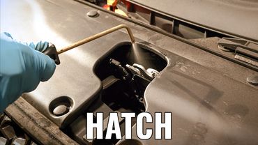 Hatch of fleet vehicle getting rustproofing corrosion protection for fleet cars, trucks, suvs.