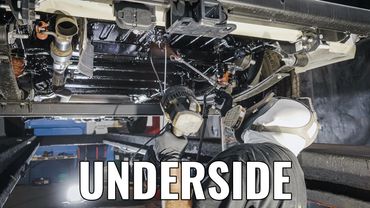 Underside of fleet vehicle getting rustproofing corrosion protection for fleet cars, trucks, suvs.