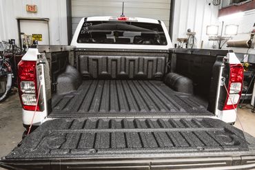 A premium, well-executed spray-in bedliner job from Madison Fleet Works.