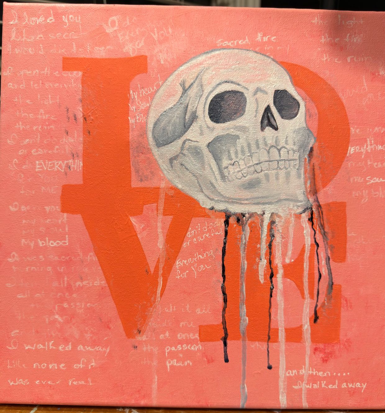 A skull with dripping paint overlays the word LOVE on a pink canvas.