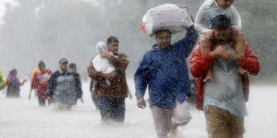 People walking under the rain