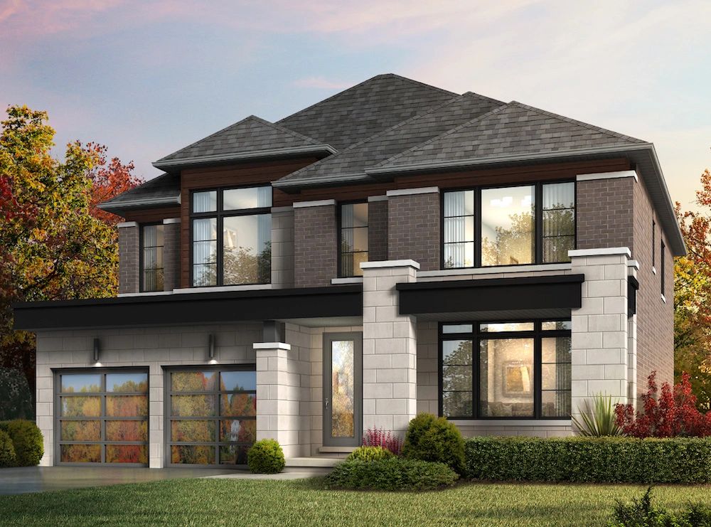 Modern two-story house with large windows and a double garage in a landscaped yard.