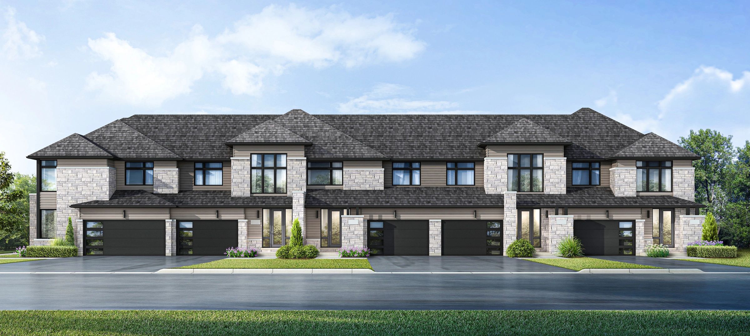 Modern townhouse complex with stone and siding exterior and dark roofs.