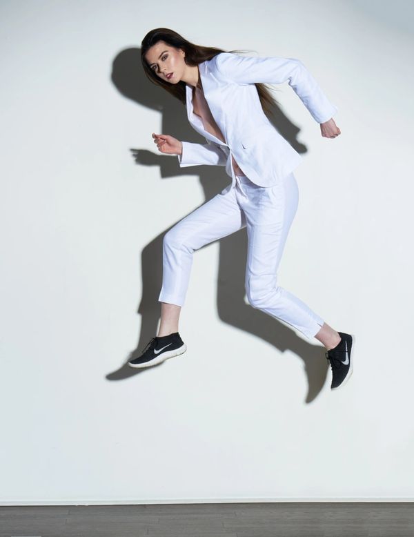 Model jumping in mid air in studio