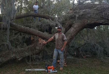 David (front) and Bill after removing a large tree that was causing damage to a house
