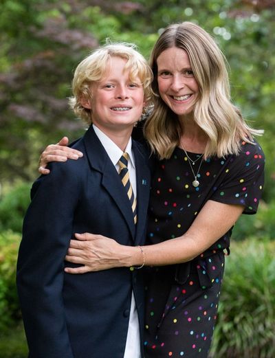 National Boys Choir chorister standing with his mother smiling together