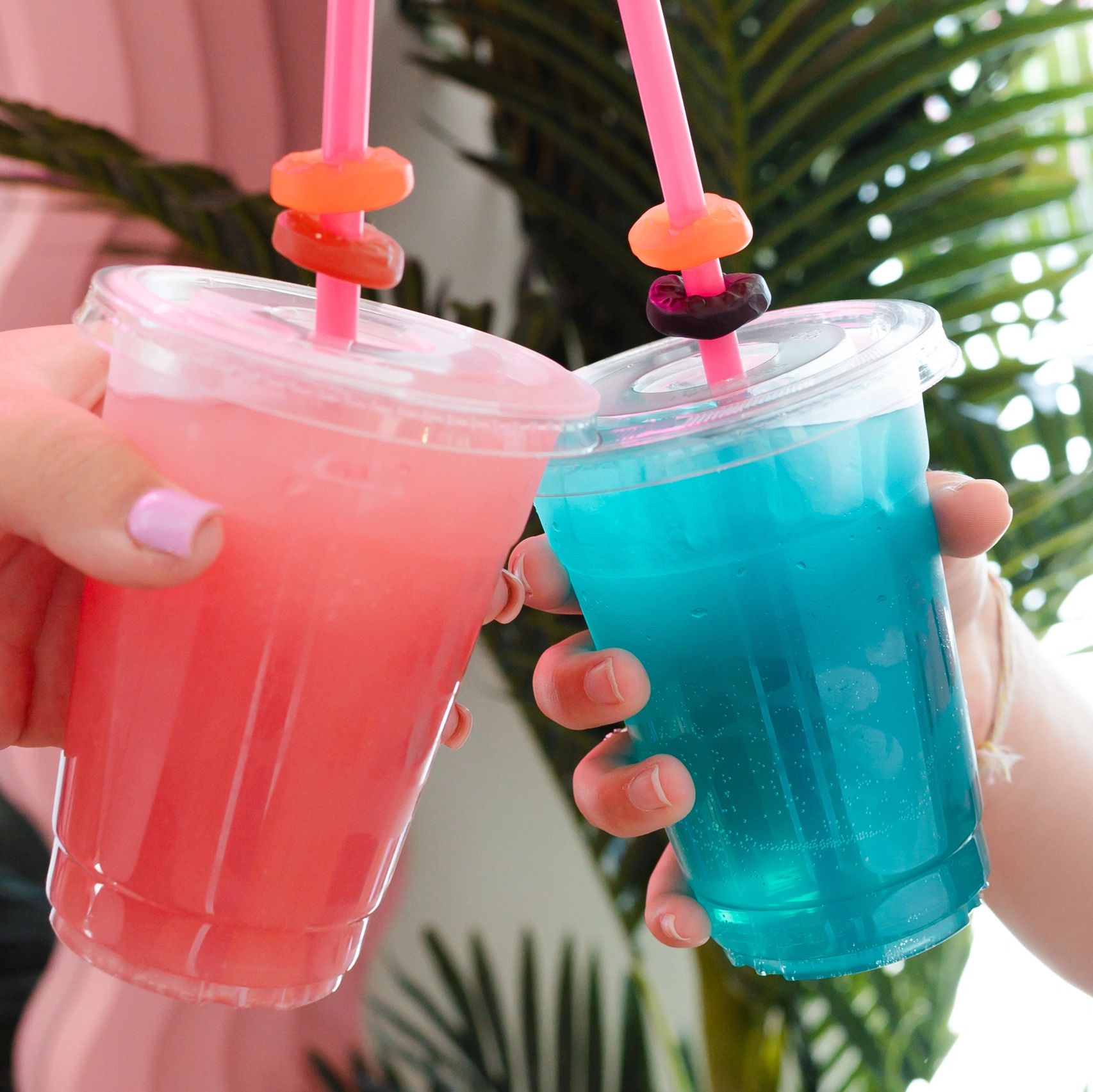 pink flamingo customers cheers with their lotus drinks