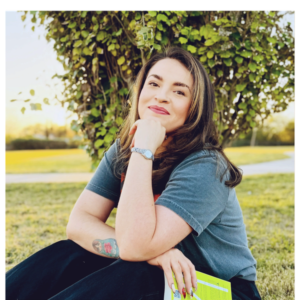 Dayna Quezada, licensed professional counselor, smiling outdoors