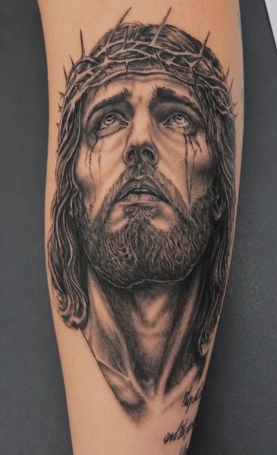 Tattoo of Jesus Christ with a crown of thorns.