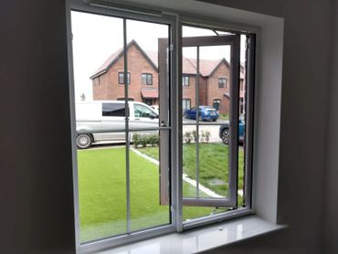 Sitting room window retractable fly screen / insect screen