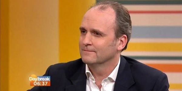 A man in a suit on a daytime TV show called Daybreak.