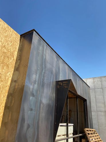 Welding Steel Structure Mesa, Arizona Modern industrial style building facade with metal.