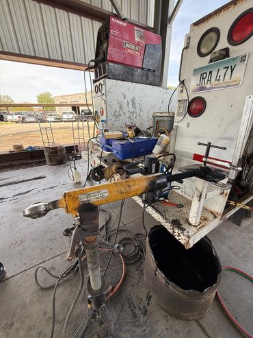 A truck with tools and equipment on the floor.
