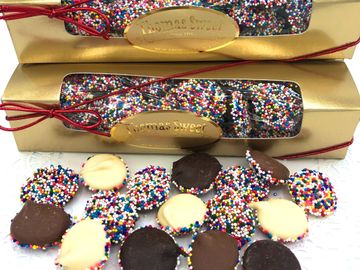 Milk, dark, white, or a mix of two or three chocolate non-pareils in our gold window box.