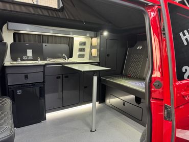cherry red T6.1 campervan, brand new conversion, Leighton vans kit, campervan kitchen, west dubs