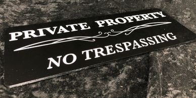 Laser engraved "Private Property, No Trespassing" sign created by Pirate Monkey Art