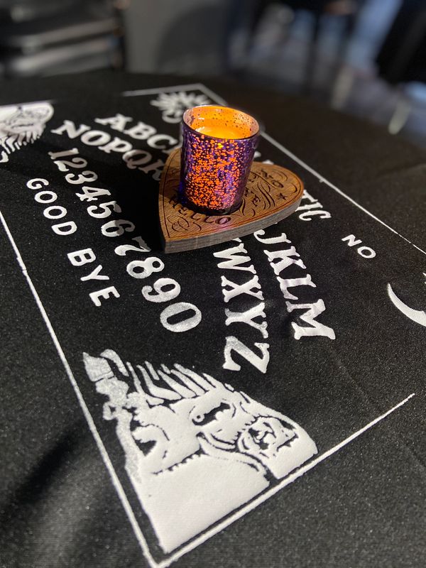 Ouija board table cloth with candle holder
