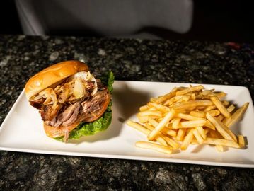 Juicy roasted pork marinated in Cuban spices, served on fresh bread. Flavorful and satisfying. Serve