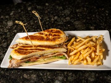 Grilled pork steak seasoned with garlic and spices, served on fresh bread. Bold and juicy. Served wi