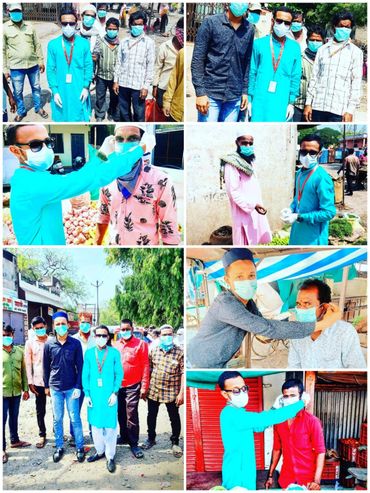 People wearing masks and practicing safety measures in a community setting.
