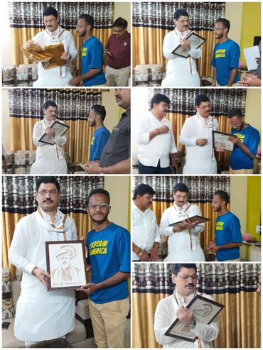 Two men exchanging a framed portrait in a living room setting.