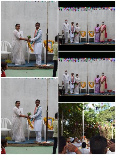 People participating in a ceremonial event with floral tributes and flag hoisting.