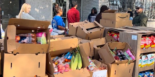 boxes of produce with chips in distribution drive.