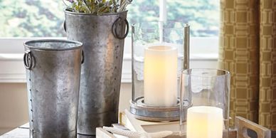 metal  vases with lavendar, white candles in glass candle holders