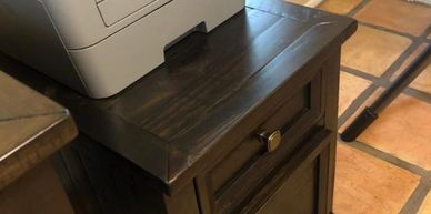 wood file cabinet with printer sitting on top