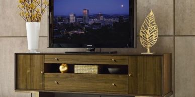 wood modern contemporary media console with tv sitting on it