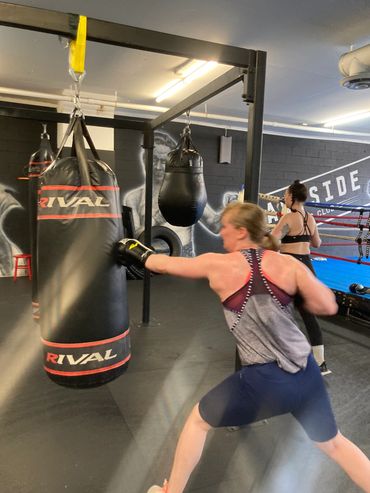 Hitting the bag at boxing practice at Eastside Boxing Club