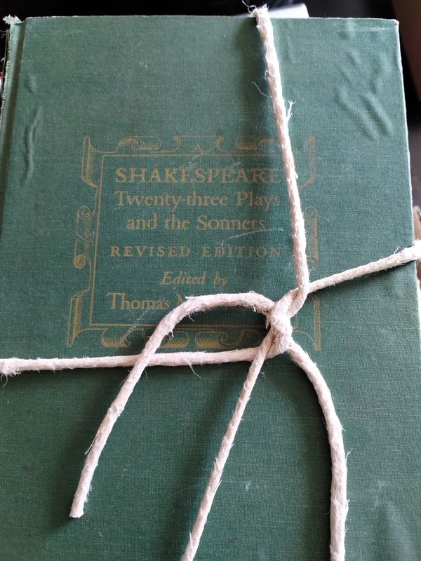 Old green book titled Shakespeare's plays and sonnets tied with a string.