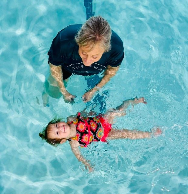 Survival Swim Instructor with baby in the water.