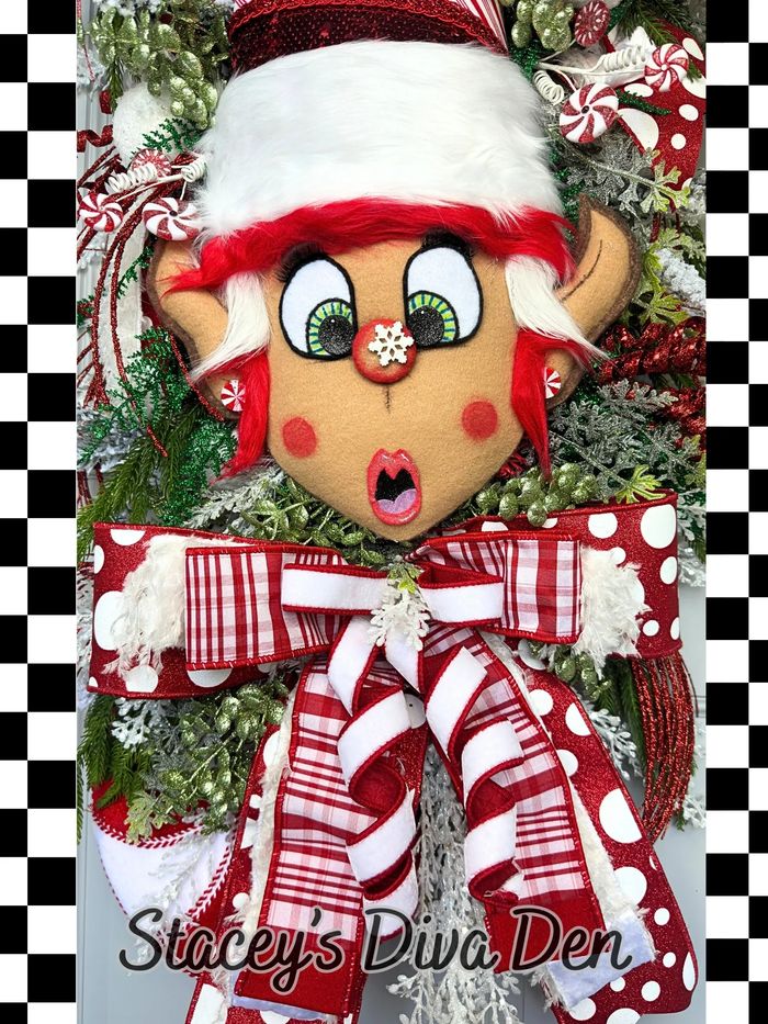 Festive Christmas elf decoration with red and white ribbons and greenery.