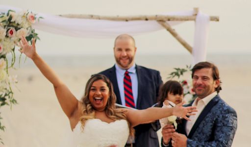 The bride and groom show their excitement after Jim Hill declares them husband and wife.