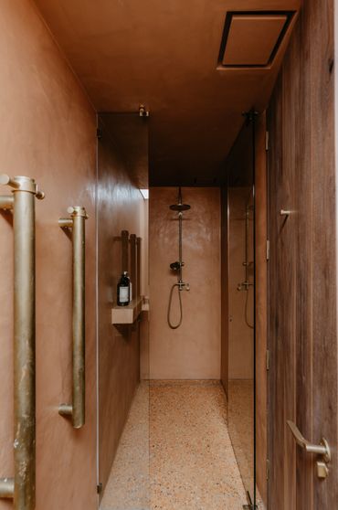 Main bathroom using terrazzo and micro cement throughout.