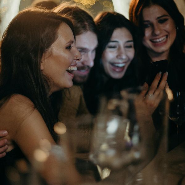 A group of people laughing and celebrating together