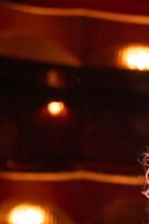 Dimly lit theater interior with warm lighting.